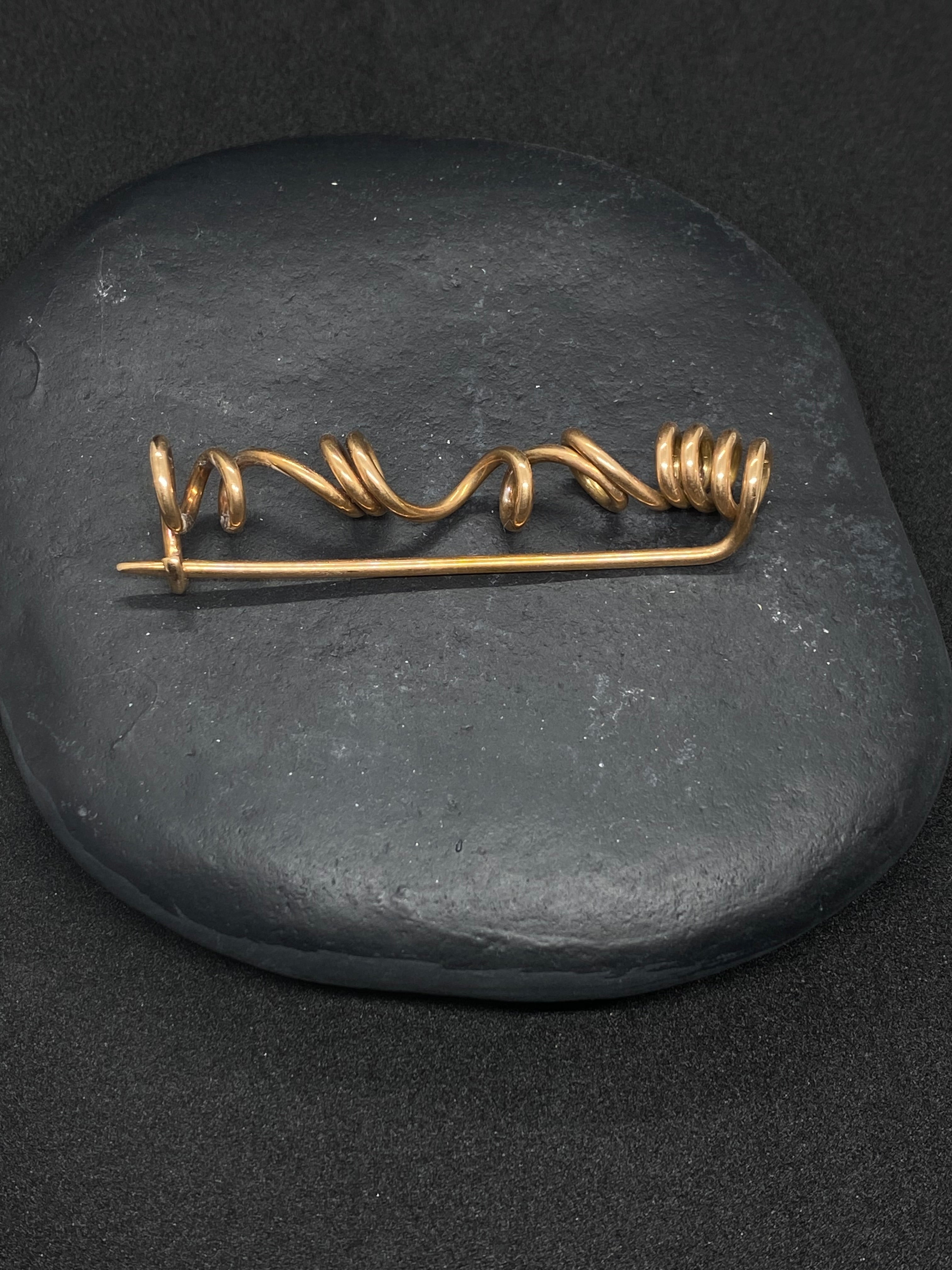 Spiral brooch in bronze