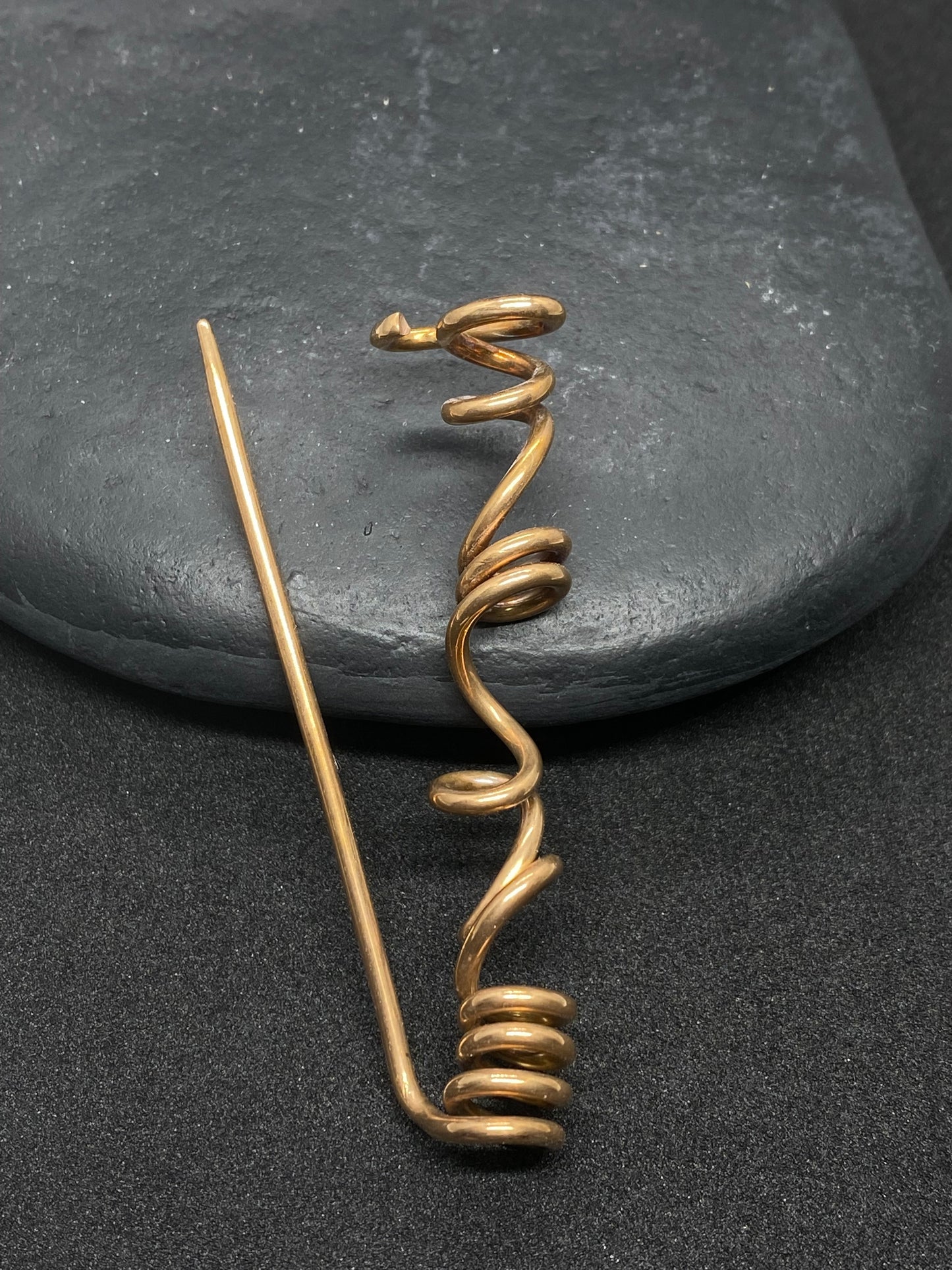 Spiral brooch in bronze