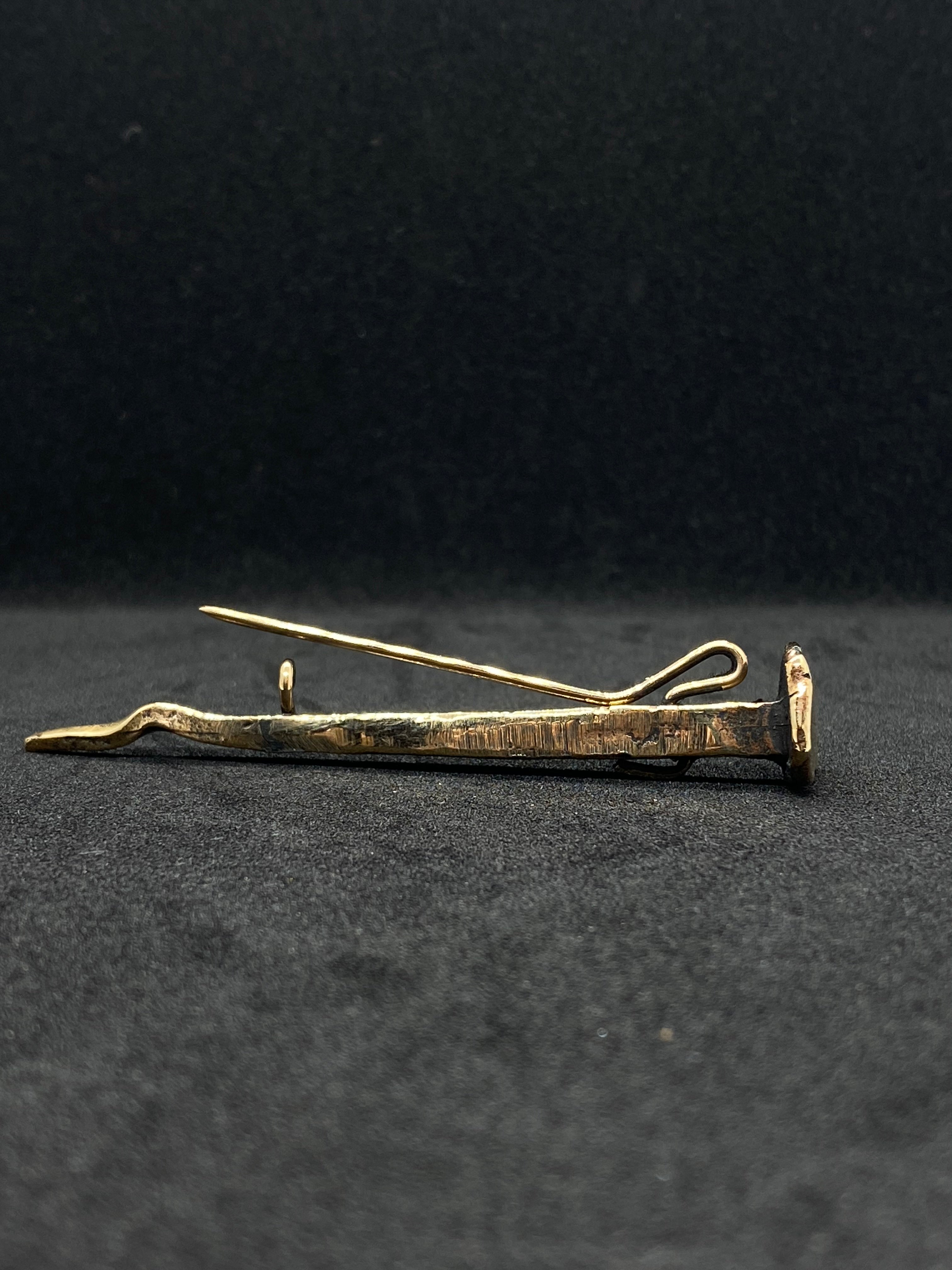Bronze nail brooch